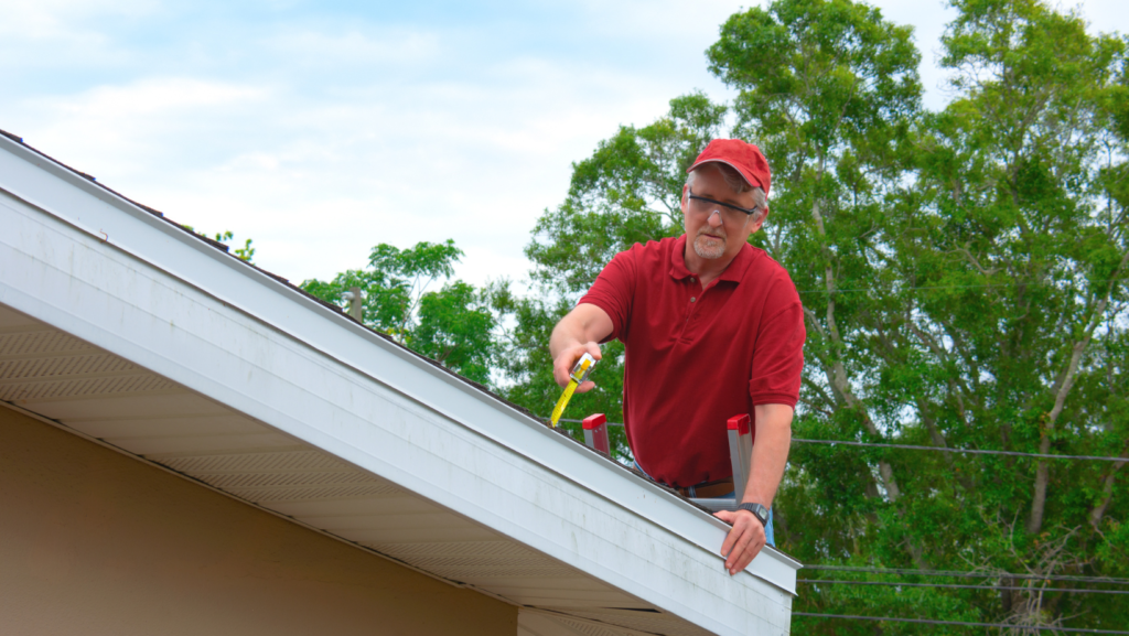 home inspector doing a wind mitigation inspection